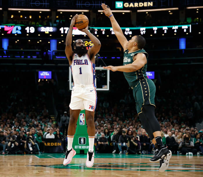 76ers guard James Harden shoots over Celtics forward Grant Williams.